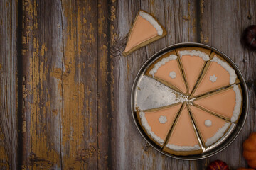 Fototapeta na wymiar Pumpkin pie cookies on wooden rustic table copy space