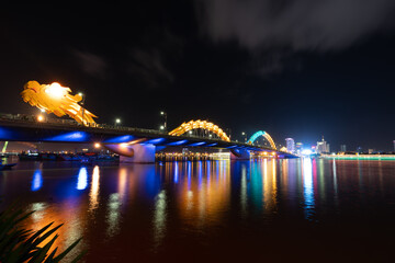 Dragon river bridge ( rong bridge) in da nang, (cau rong) over the han river at downtown of da nang (danang), vietnam. beautiful cityscape. the dragon bridge is a popular tourist attraction of asia.