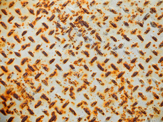 Grated Metal Surface White and Rusty Orange Texture