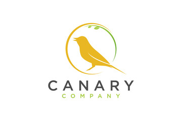 Yellow Canary bird logo design perched on a tree branch organic nature earth animal - obrazy, fototapety, plakaty