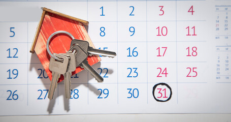 House keys on calendar background.