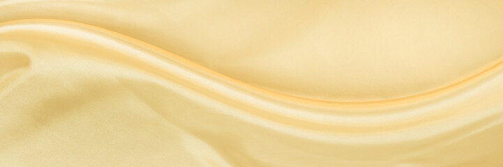 White yellow satin texture that is gray silver fabric silk background with beautiful soft blur...