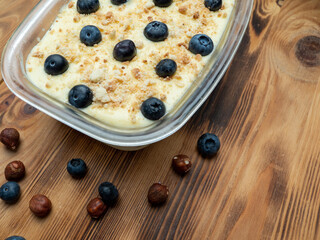 Homemade blueberry cake on a wooden table. Dessert, snack or breakfast.
