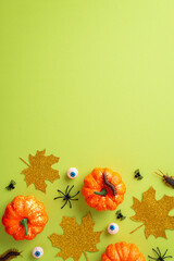 Halloween concept. Top view vertical photo of pumpkins gold sparkle leaves eyeballs spiders...