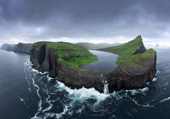 Island in middle of stormy sea