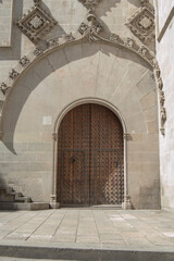 Fototapeta na wymiar Gothic entrance door of the Casa de la Ciudad de Barcelona building in Barcelona. Spain