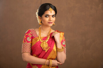 Beautiful Indian young Hindu Bride jewelry on studio shot.
