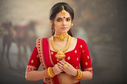 Beautiful Indian woman in traditional dress and jewelry.