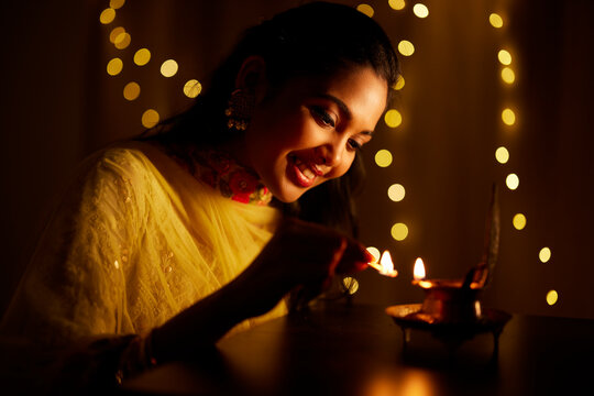 Portrait Of A Indian Traditional Girl Holding Diya Girl Celebrating Diwali  Or Deepavali With Holding Oil Lamp During Festival Of Light On White  Background Stock Photo Picture And Royalty Free Image Image
