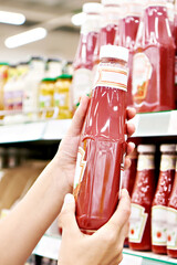 Packing of tomato ketchup in hands