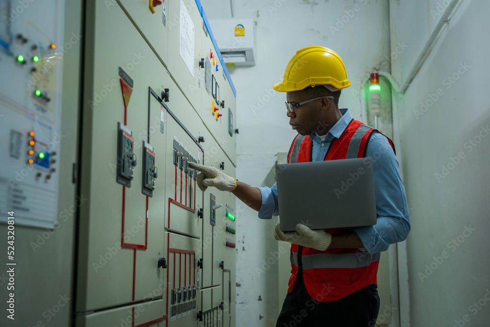 Aufkleber engineer working in electrical room with power energy motor machinery cabinets with panel in control