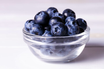 Ripe blueberries in glass gravy boat