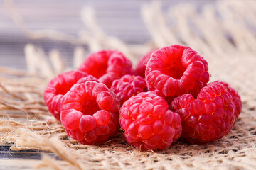 Ripe red raspberries on burlap