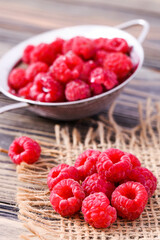Ripe red raspberries in colander