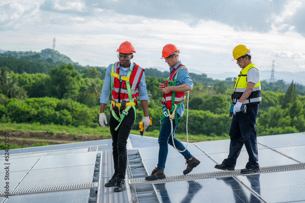 Poster engineer with technician working and maintenance with solar batteries near solar panels at sunny day