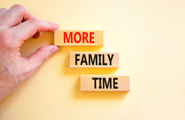 More family time and support symbol. Concept words More family time on wooden blocks. Businessman hand. Beautiful white table white background. Business, more family time qoute concept. Copy space.