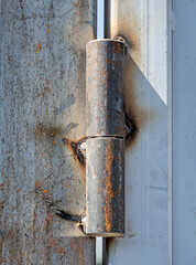 Metal hinge on the gate. A greasy loop when installing a metal structure.