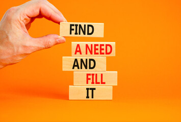 Find a need and fill it symbol. Concept words Find a need and fill it on wooden blocks on a beautiful orange background. Businessman hand. Business and find a need and fill it concept. Copy space.