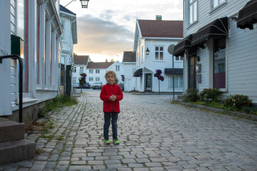 Fototapeta na wymiar Family visiting Mandal in Norway, enjoying views, kids playing on sunset