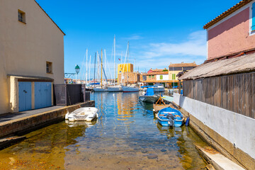A small residential boat launch in the planned waterfront community of Port Grimaud, France, along the Cote d'Azur French Riviera near St. Tropez.