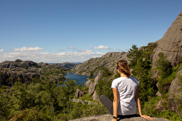 Naklejka na ściany i meble Happy people, enjoying amazing views in South Norway coastline, fjords, lakes, beautiful nature