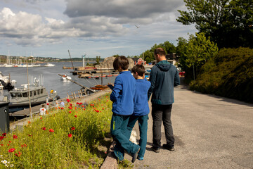 Beautiful town Kristiansand in Norway, family visiting Norway for summer vacation