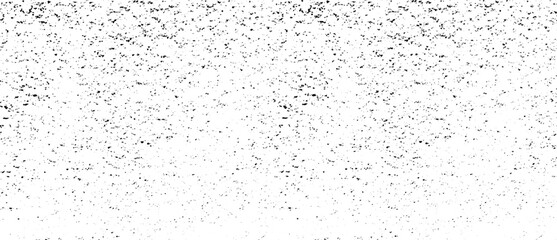 Small uneven spots and particles of debris. Abstract vector texture. Distressed uneven background. Grunge texture overlay with fine grains isolated on white background. Vector illustration. EPS10.