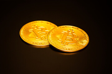 Bitcoin on a black background with reflection