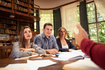 Group of students studying together at the University library