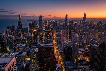 Cityscape aerial view of Chicago from observation deck at sunset.