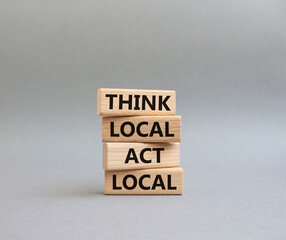 Think global act local symbol. Wooden blocks with words Think global act local . Beautiful grey background. Business and Think global act local concept. Copy space.