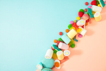 Creative Halloween.concept many sweets for children in one place, a delicious junk snack. Flat lay, pastel blue background.