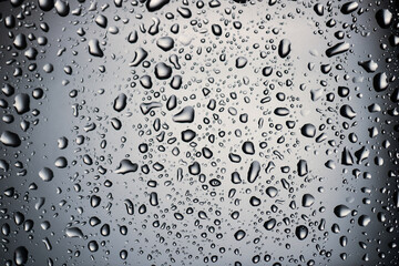 Abstract background image of water droplets perched on glass. background concept about water