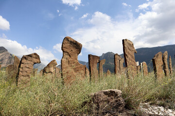 ancient cemetery of highlander warriors with gravestones in the form of saber hilts on the mountain in Dagestan, Russia