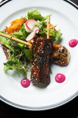 grilled cheese on stick dish with spicy sauce