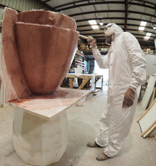 a Worker building mold for factory production