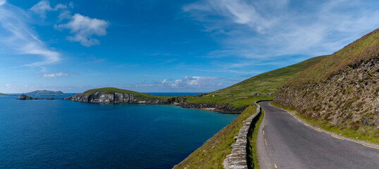 Wild Atlantic Way coastal road leads to Slea Head on Dingle Peninsula in County Kerry of western Ireland - obrazy, fototapety, plakaty