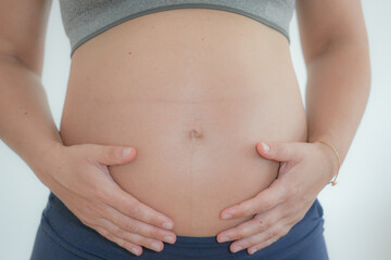 Pregnant expecting Mother showing baby belly.