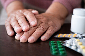 Close up of hand holding pills on black background expensive medicines