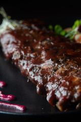 close up of ribs with barbacue dish on a table of a fancy restaurant