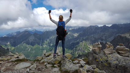 Woman top of the mountain. Photo taken after reaching the top of Rysa. 14 August 2017 Tatras...