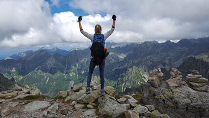 Woman top of the mountain. Photo taken after reaching the top of Rysa. 14 August 2017 Tatras zakopane © SarahPictures