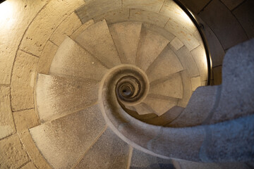 Top view of the spiral staircase in the tower. Walking down old the winding stairs