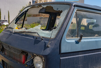 Close-up of the broken windshield on the car. Cracks in the glass after a car accident. close-up