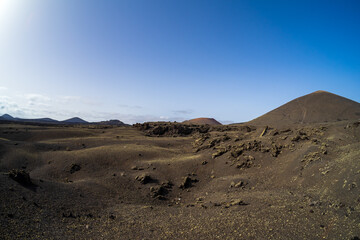 Typical volcanic landscape in the area of Caldera de Los Cuervos. Lanzarote, Canary Islands. Spain.