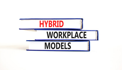 Hybrid workplace models and support symbol. Concept words Hybrid workplace models on books. Beautiful white table white background. Business and Hybrid workplace models quote concept. Copy space