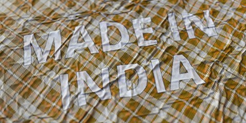 MADE IN INDIA text printed on a fabric, national textile production conceptual 3d rendering