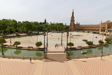 Panoramic view of the Plaza de Espana in Seville in Spain. One of the most spectacular monuments in the world and one of the best buildings of Andalusian regionalism. - obrazy, fototapety, plakaty