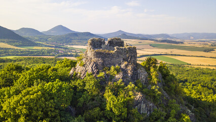 Obraz premium Aerial view of Oltarik mountain with gothic castle ruins. Ceske Stredohori, Czech Republic, Europe.