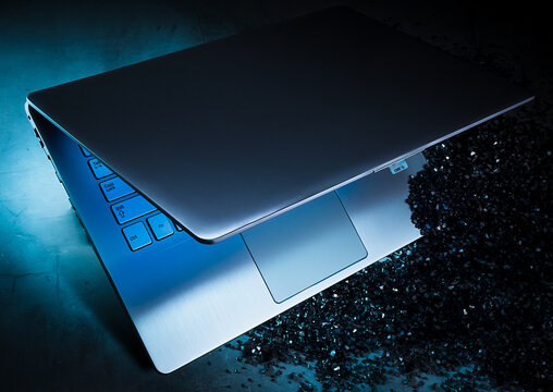 Metallic laptop in blue light, advertising look